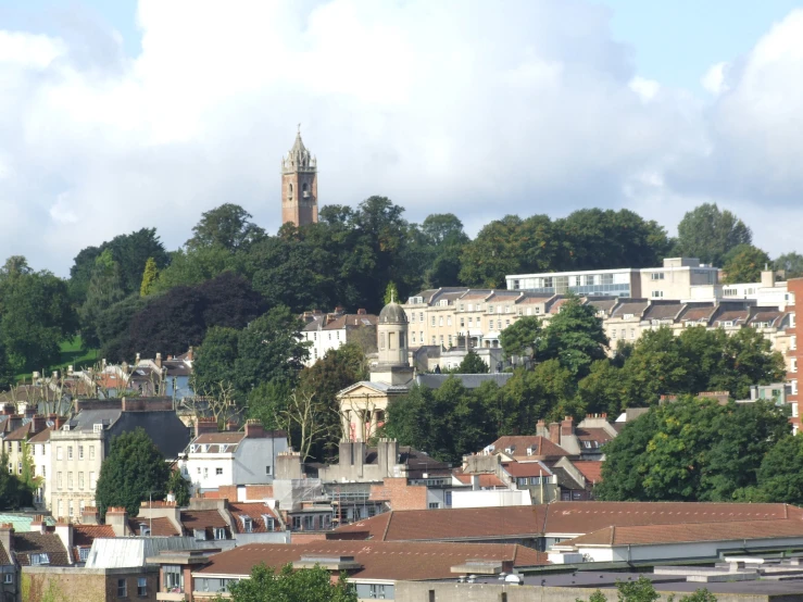 a very tall clock tower towering over a city