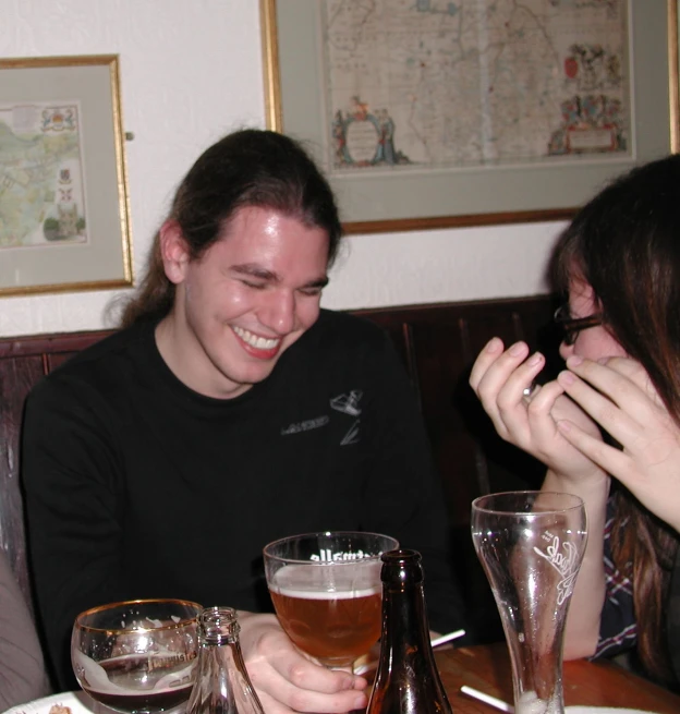 a couple having drinks in a pub together