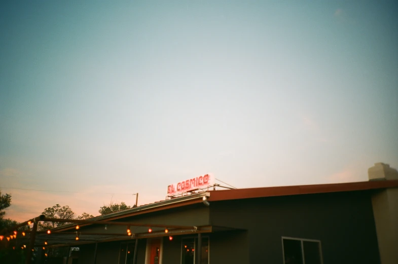 an open roof top restaurant with the sky in the background