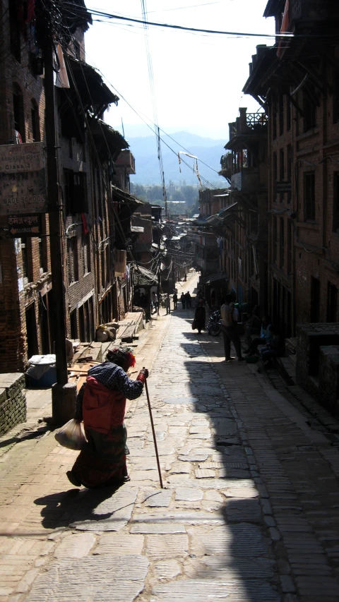 a street lined with buildings and cobblestones