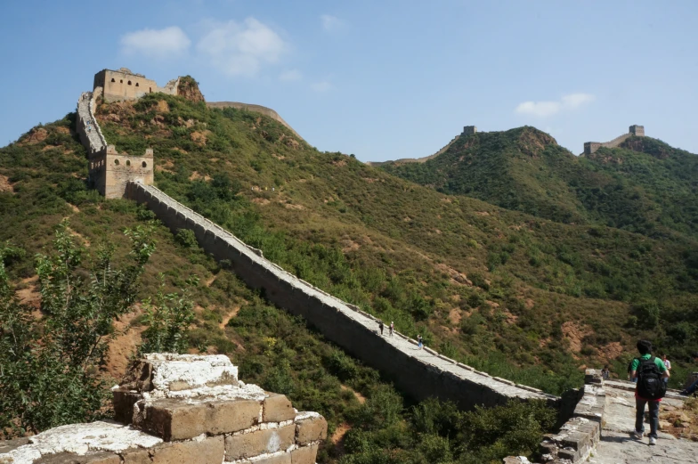 a long stone walkway down to a large building