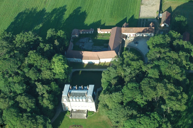 an aerial s shows the house and surrounding trees