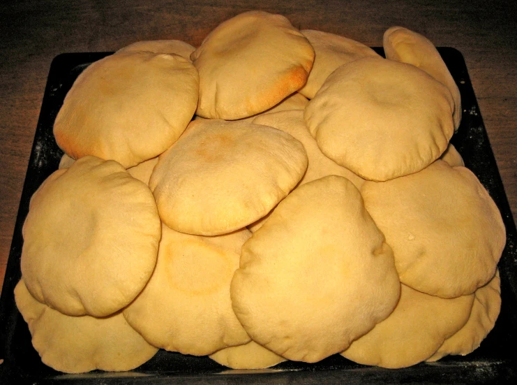 a bunch of cookies on a pan ready to be baked