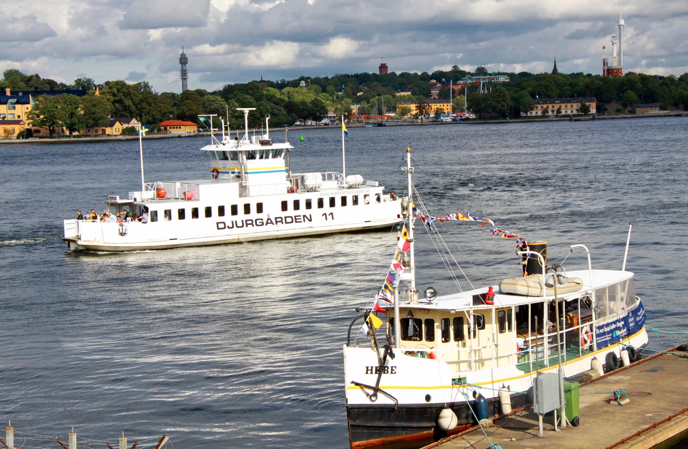 two large boats are docked at the dock