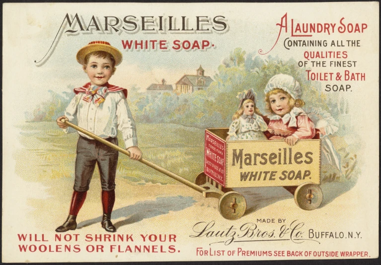 a postcard shows two children in a wagon with a large soap