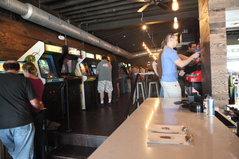 people at the bar with many types of bar equipment