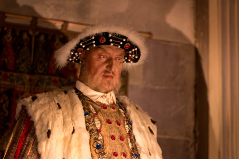 a man wearing costume sitting in a room