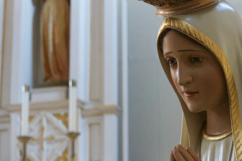 the statue of the virgin mary appears to have a prayer