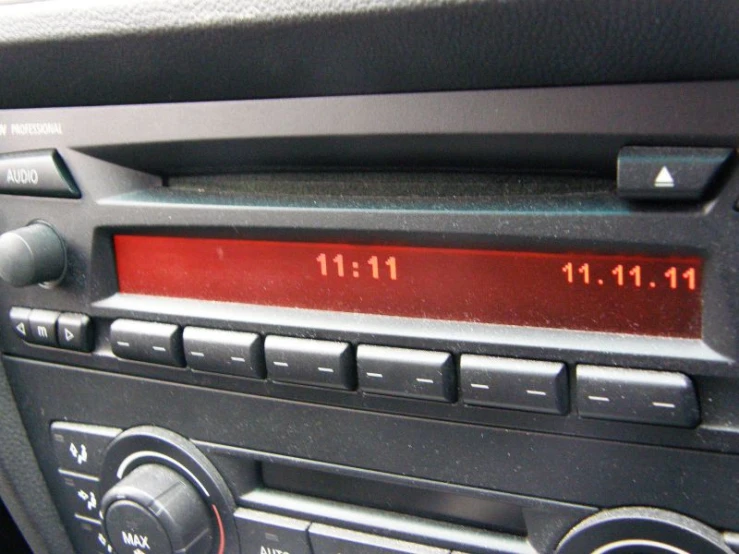 an old radio with the time displayed in red