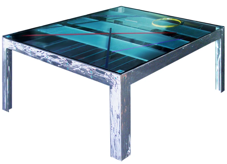 a glass table with an image of an abstract figure on top