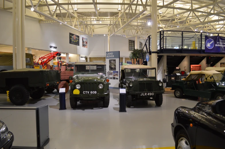 a view inside a showroom showing vehicles