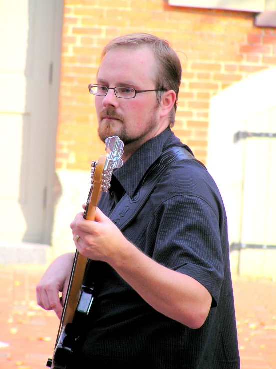 a man holding a microphone up with his hand