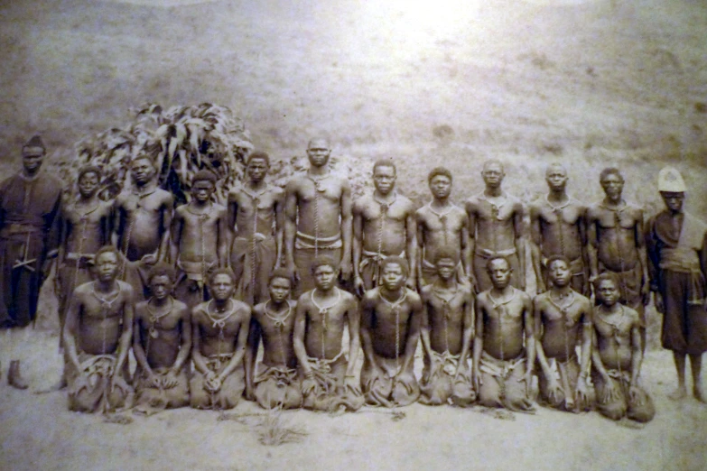 a group of men pose for a pograph