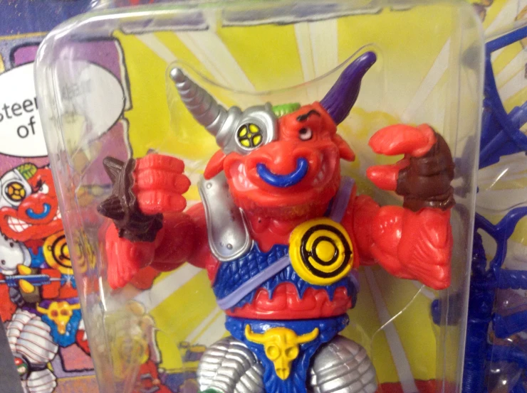 a toy figure in a plastic case with the name'm o n d