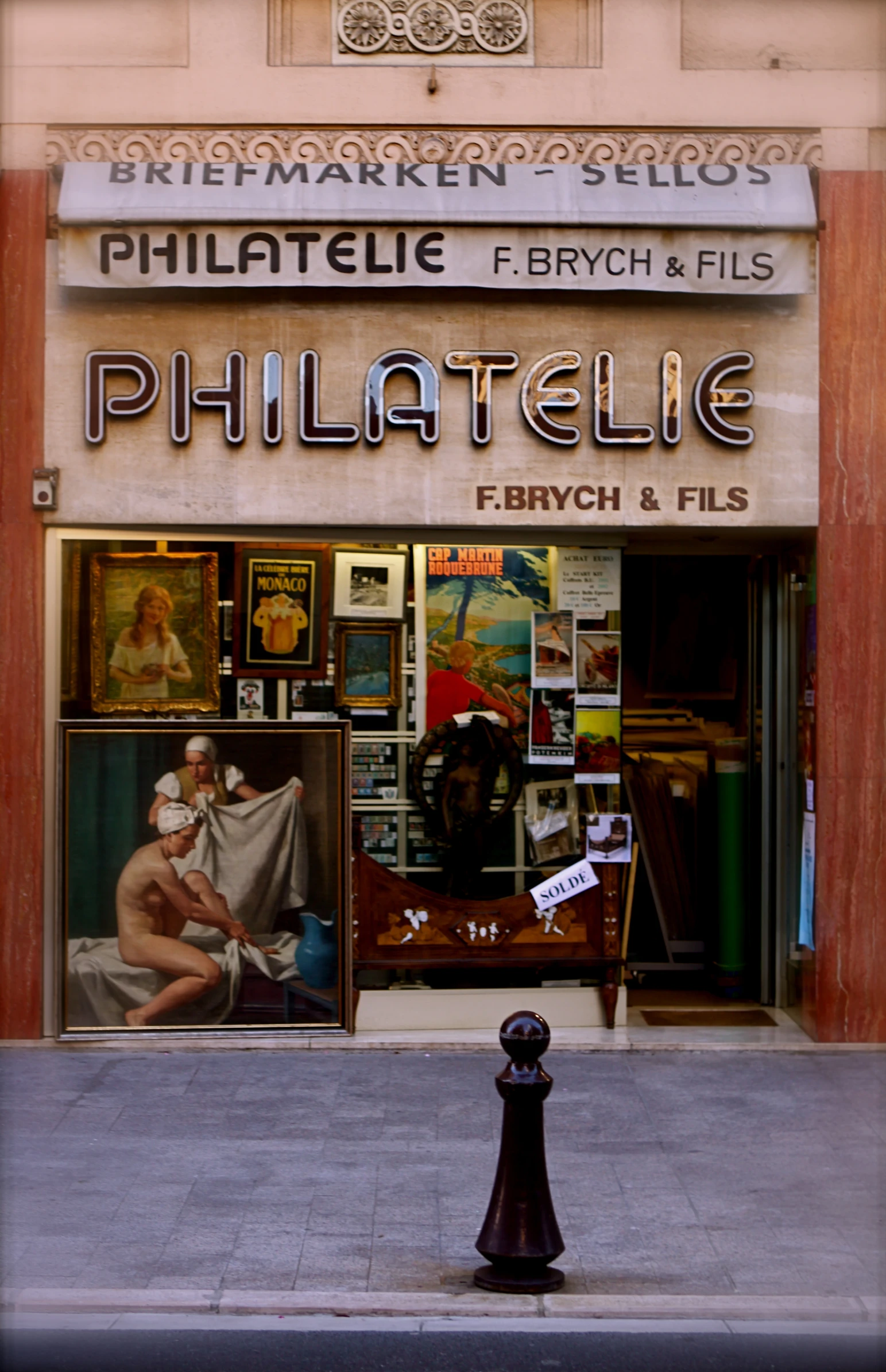 the store front of a furniture store on a busy city street