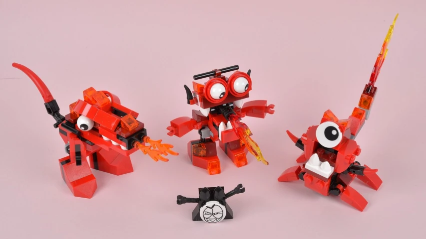 three lego toys, one with an animal figure