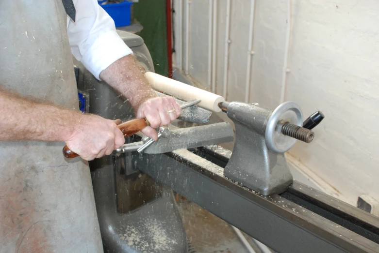 a man with a pair of tools in his hand