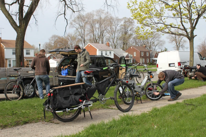 a bicycle is parked along the side of a grassy street