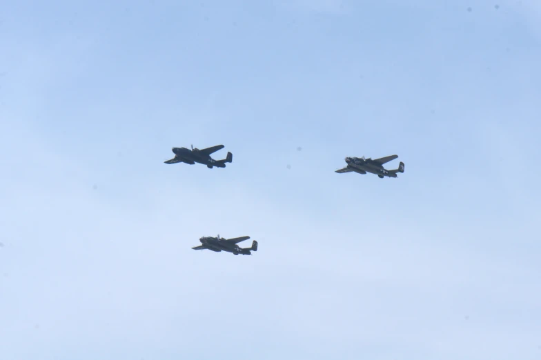 a group of four planes flying in formation