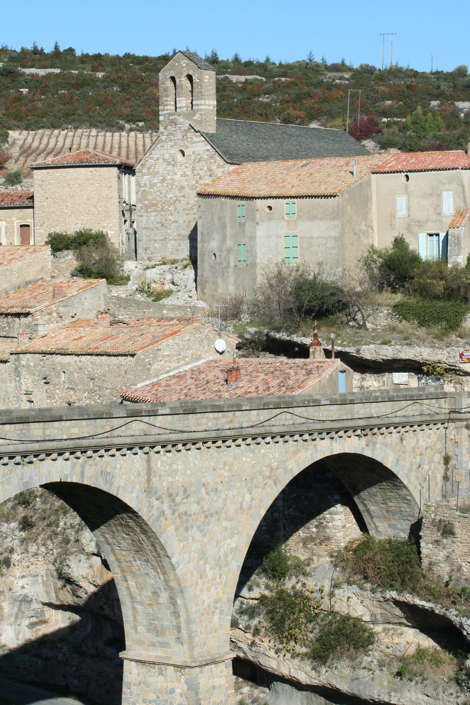 there are some buildings and a bridge in the village