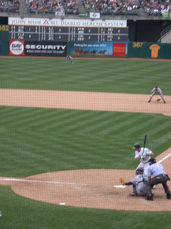 the men are playing baseball on the field