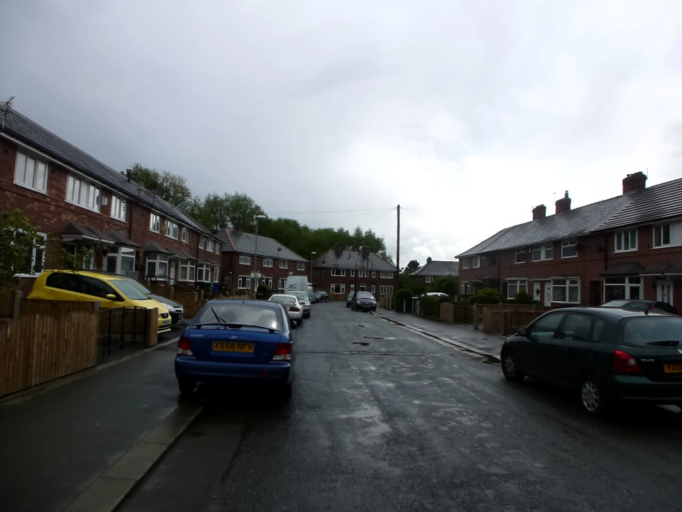 two cars parked on both sides of the street