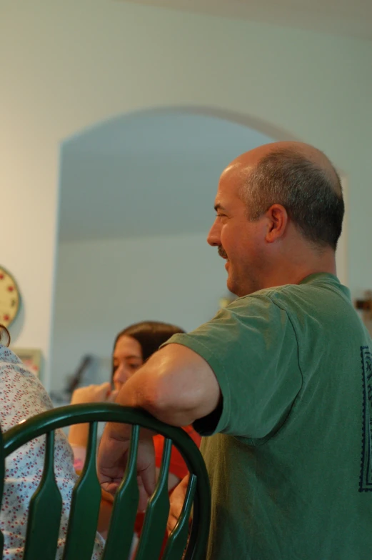 a man and a woman holding soing while standing next to each other