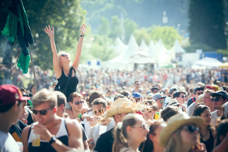 a crowd at an outdoor music festival