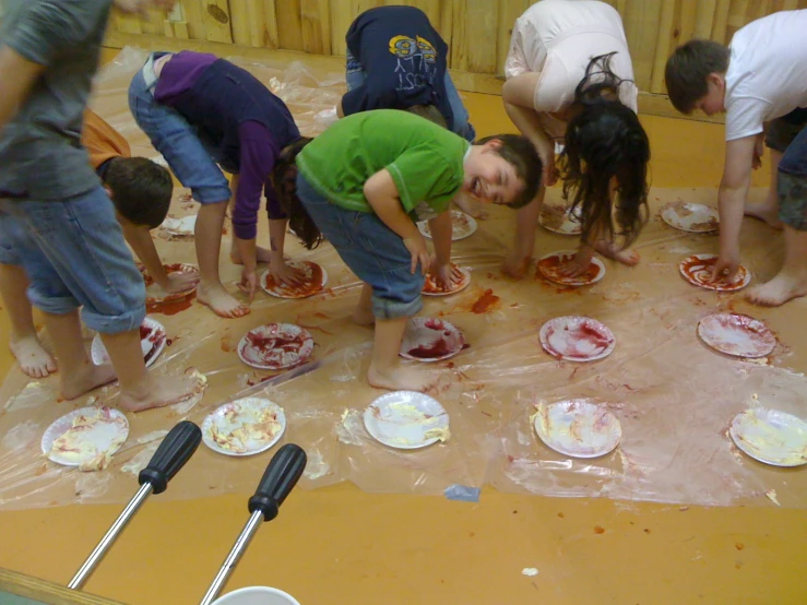 a group of s with plates covered in food