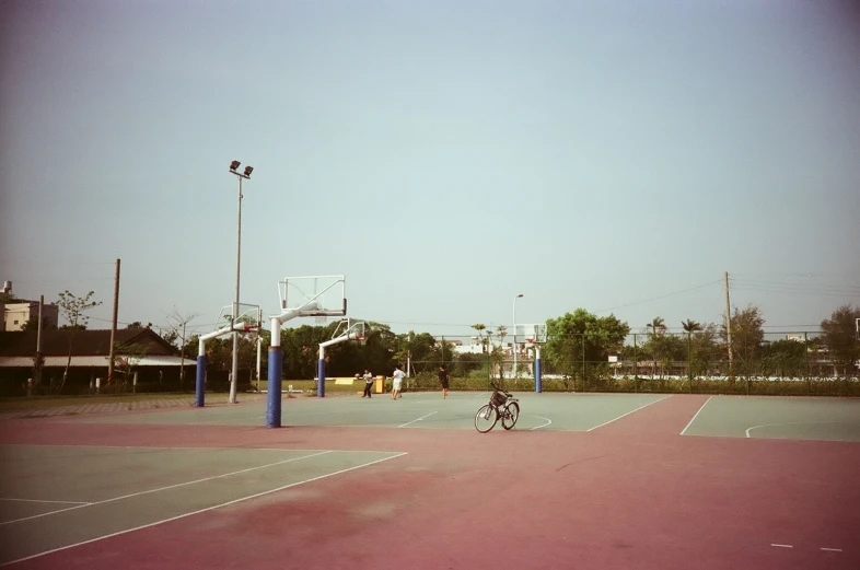 a man is getting ready to hit the ball in an empty court
