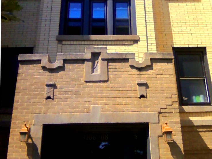 a building with brick features and decorative windows