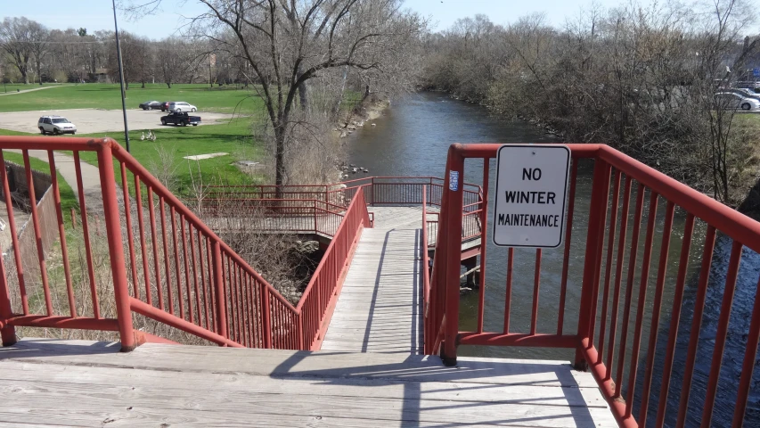 a bridge with a sign indicating no winter on the walk