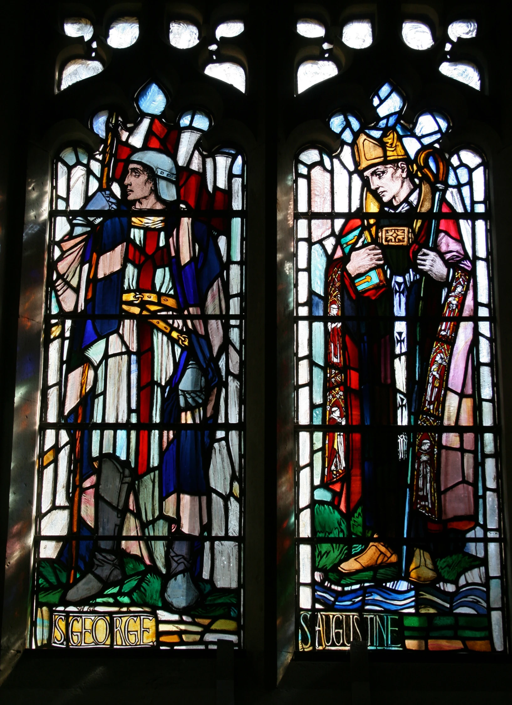 stained glass window with two figures of king and queen