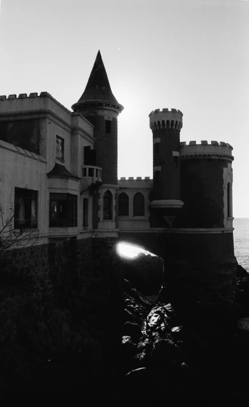 black and white pograph of castle by the ocean