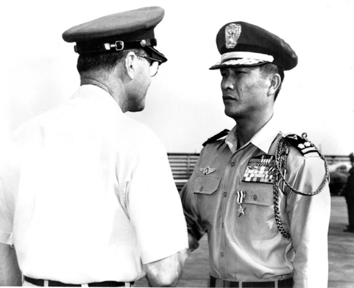 black and white po of two military men