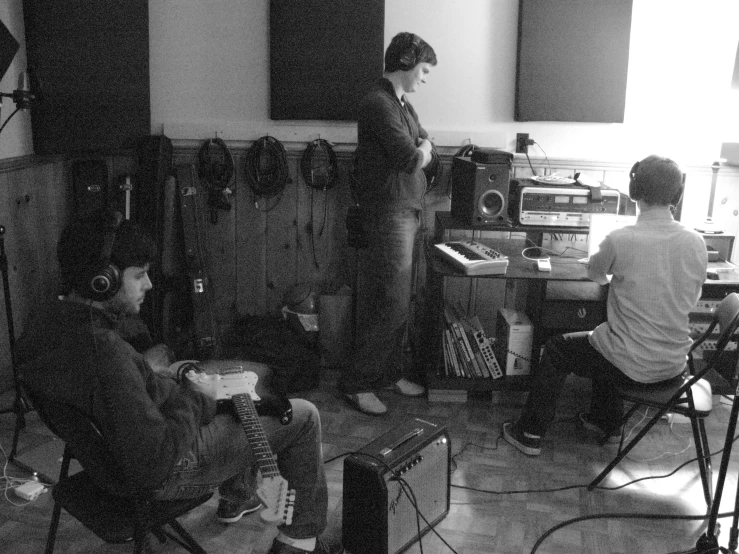 two people are in a recording studio and recording