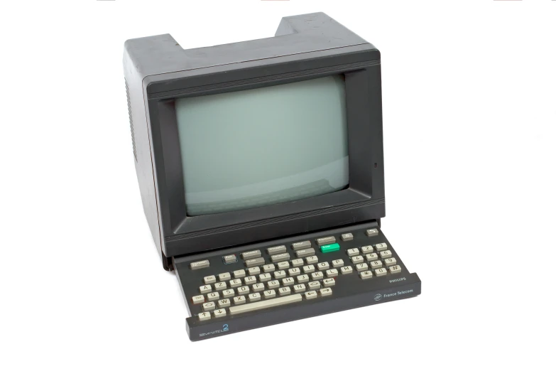 an old fashioned computer that is in the shape of a television