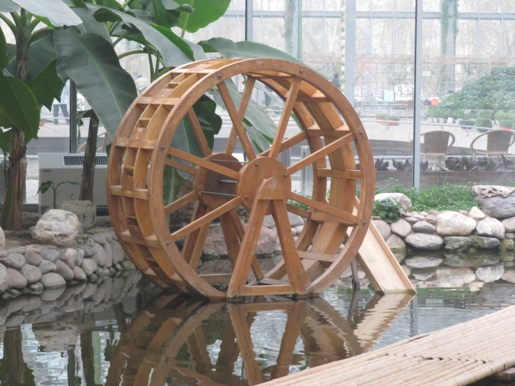 an image of a water wheel that is on the water
