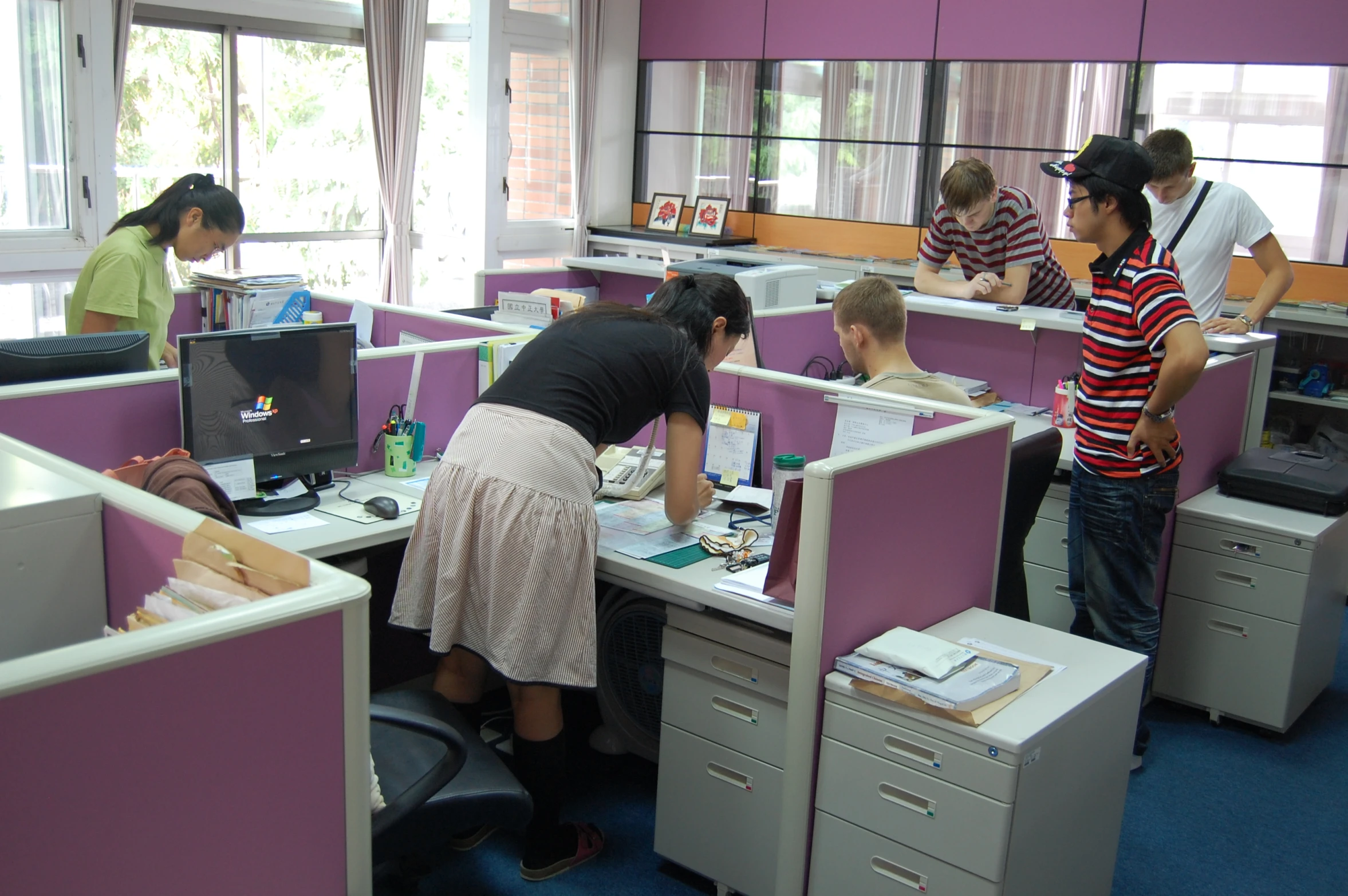 an office filled with people working on computers