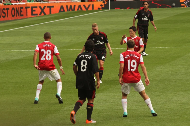 a soccer team that is on the field playing a game