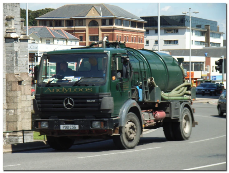 a large truck is driving down the road