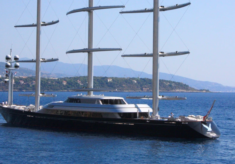 a large sail boat sails through the ocean