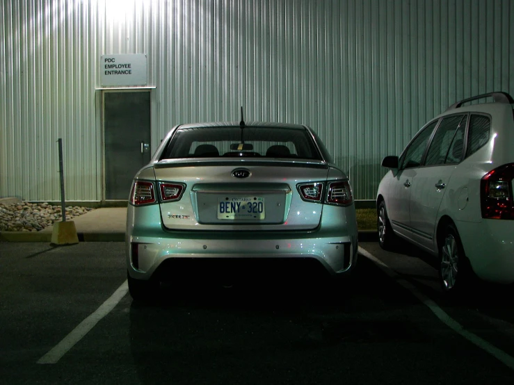 the two cars are parked next to each other