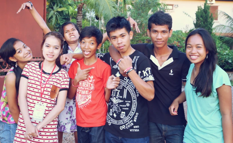 a group of young people posing together for a picture