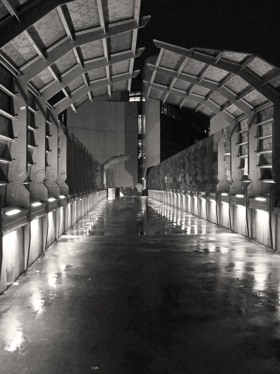 a building is lined with tables and lighted walkways