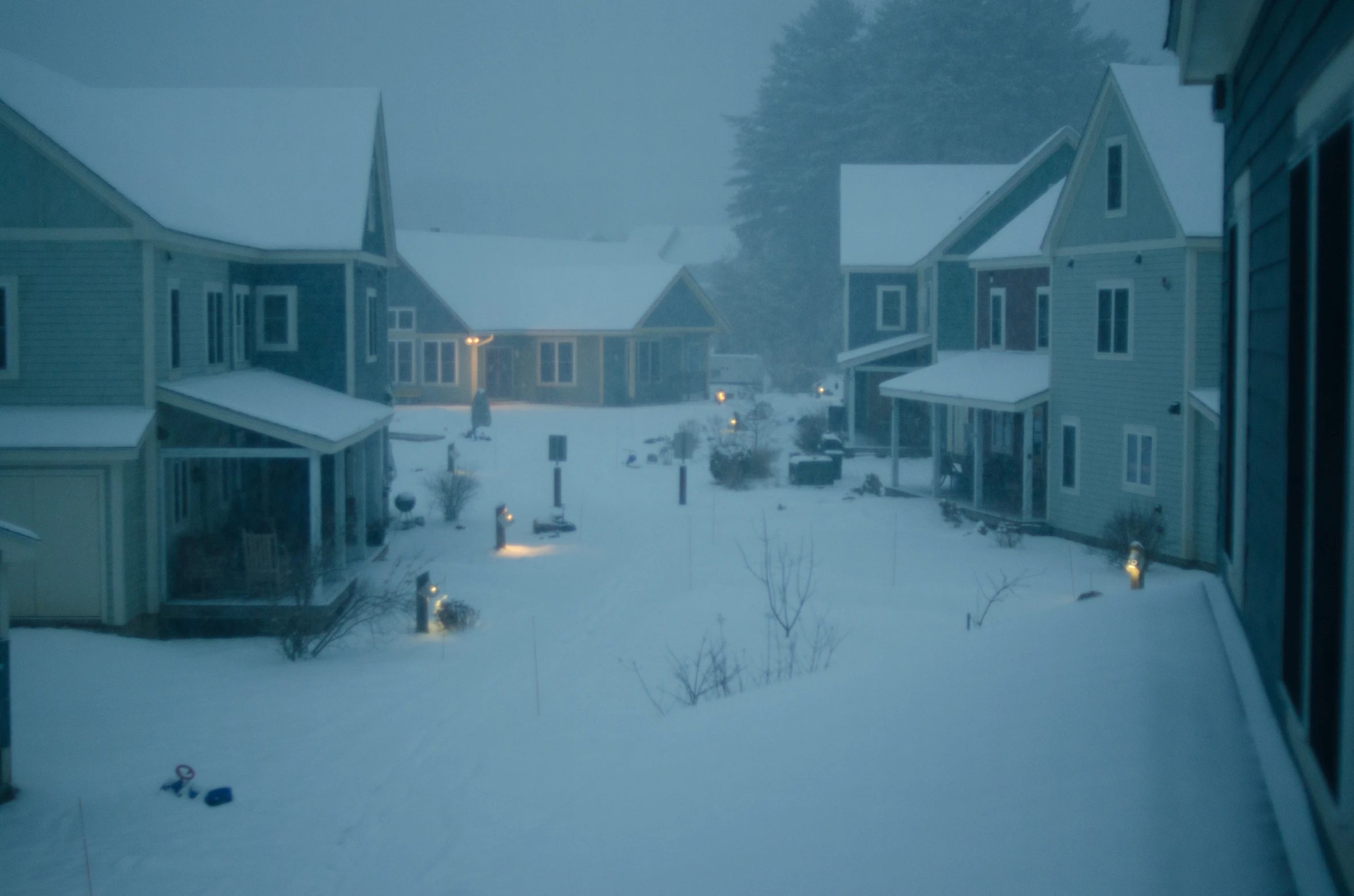 the view from a window looking at homes