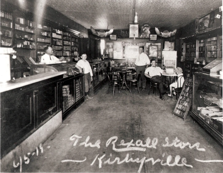 an old po shows several people sitting at tables