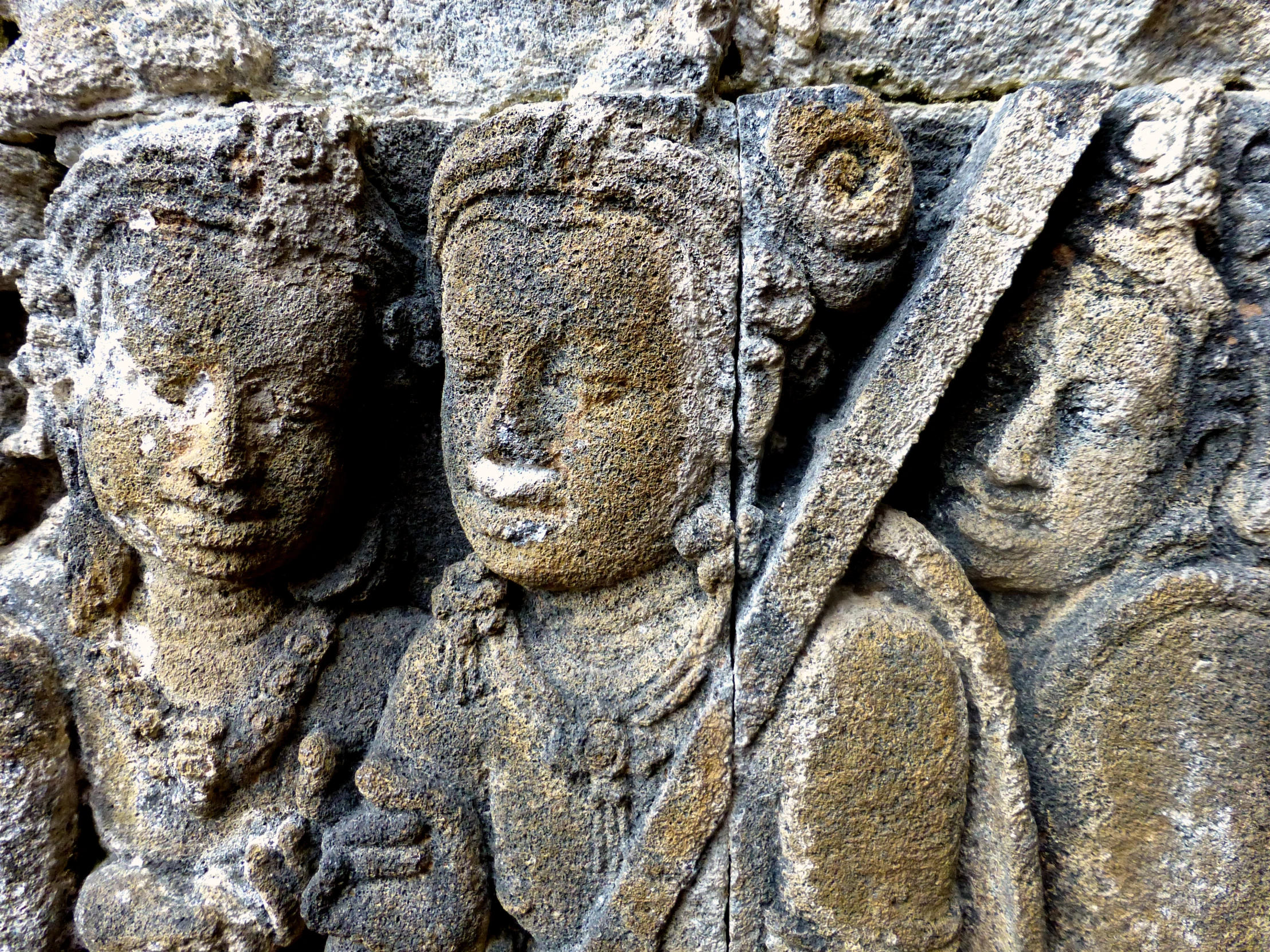 stone sculptures and other decoration decorate the walls of an old temple