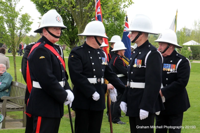 the british army is standing around in their uniforms