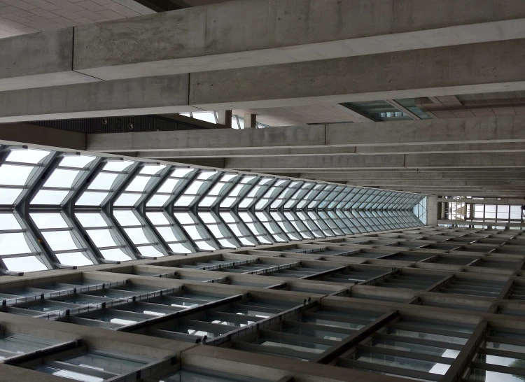 a couple of tall buildings with skylights above them